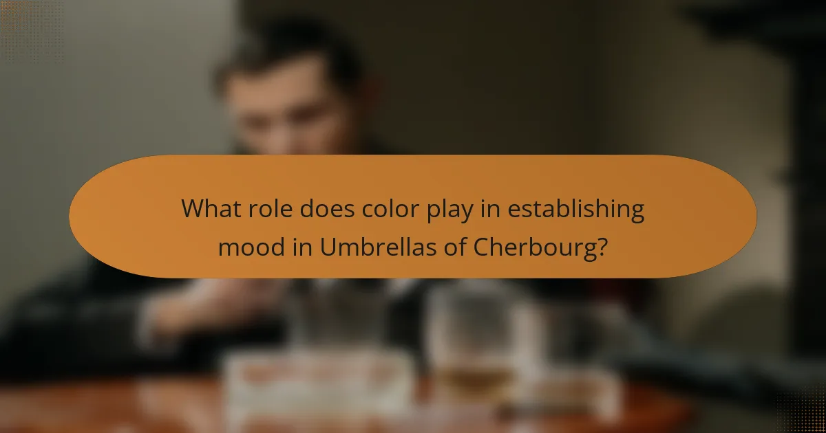 What role does color play in establishing mood in Umbrellas of Cherbourg?